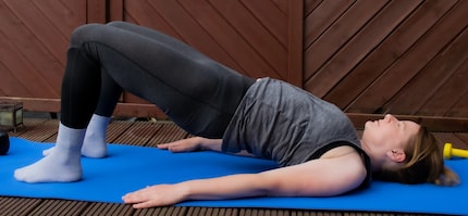 The shoulder bridge not only strengthens my back but also the muscles in my legs and bum.