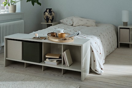 A sideboard looks good against the wall, but also at the foot of the bed.