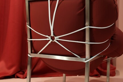 The flexible cushions are designed to make you want to move around on the chair and provide a contrast to the rigid steel construction.