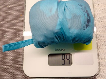 The jacket is a featherweight. However, stuffing it into the hood pocket is a bit of a hassle.