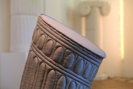 The fabric sculptures look very similar to the real columns from antiquity.