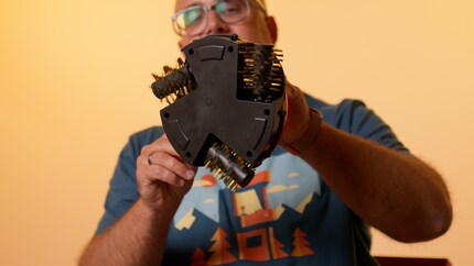 The Grillbot’s equipped with three bristle wheels to clean the grill.