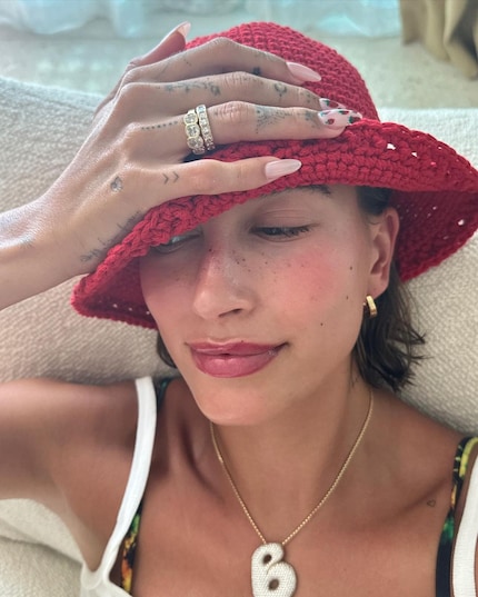 Strawberry Girl Hailey Bieber is consistent down to her fingertips. Image: Instagram @haileybieber