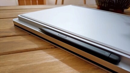 If you buy a pen, you can store it in front of the touchpad on the bottom edge and charge it.