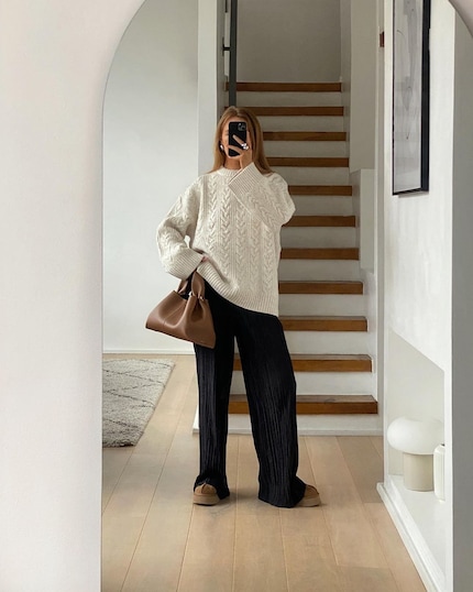 Pleated pants combine comfort and style.