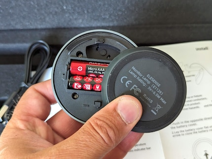 The wireless controller with two AAA batteries.