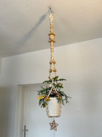 Hang a miniature Christmas tree from the ceiling.