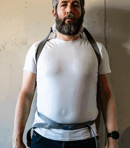 You'll have to figure out the best way to strap the machine to your shoulders yourself.