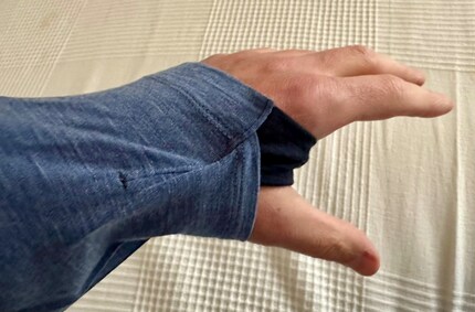 The thumb loop keeps the sleeve in place where I sometimes freeze when reading in bed.
