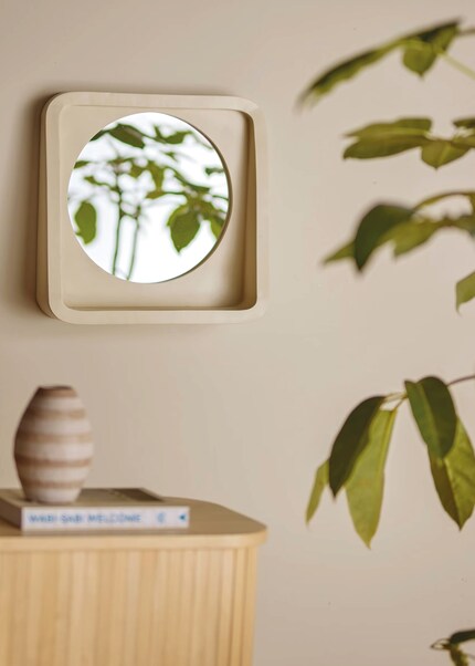 The shelf at the bottom is perfect for adding a personal touch to the mirror.