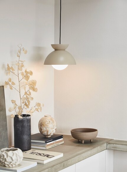 The lower the lamp, the more the spotlight shines on what’s below it.