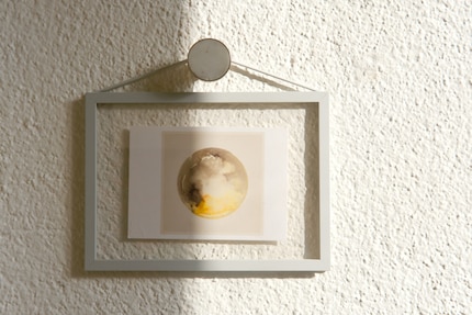 This picture frame can decorate shelves or walls.