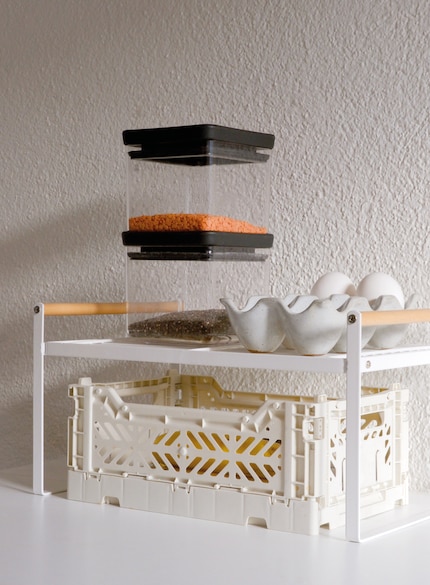 This simple shelf by Zeller is made of metal and features natural wooden struts.