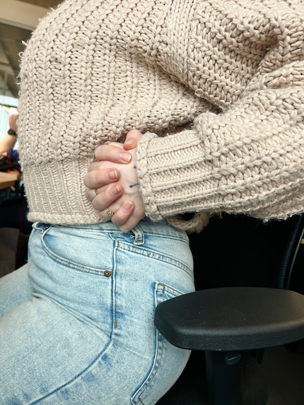 … in the direction of your interlaced hands.