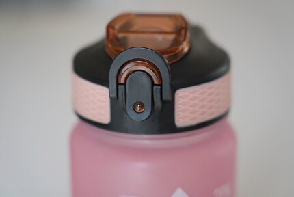 Once the lid’s closed, fold up a tab to lock the bottle.