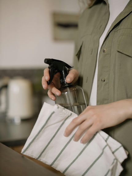 A spray bottle and a tea towel can prove very helpful when you’re ironing.