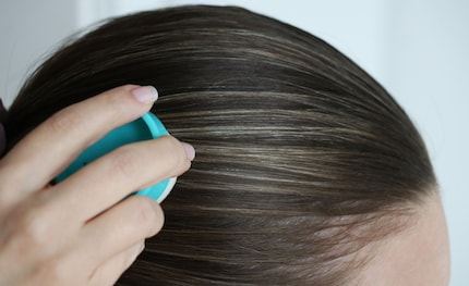 Neatly smoothed down. Those shortish strands stay in place throughout my yoga class.