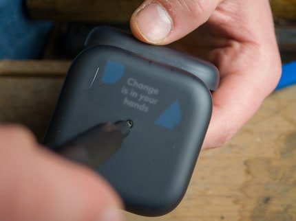 You just need to loosen one screw to remove the battery from the case.