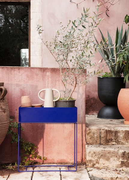 Color-blocking: The blue flower box creates an exciting contrast to the green plants and other existing colours in the garden.