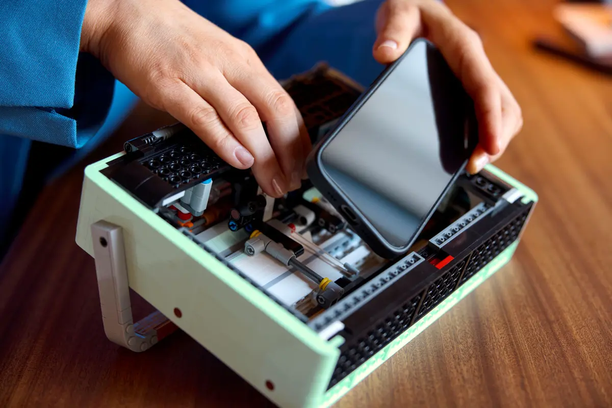 You can attach your mobile in the hinged part