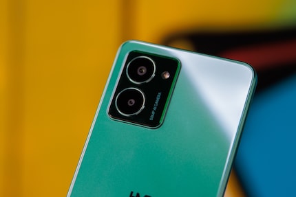 Two camera lenses, only one of which takes photos. The other provides data for certain shots.