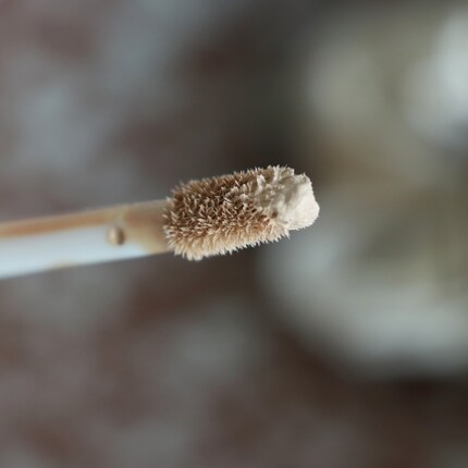 The tip is slightly pointed, allowing for precise application.