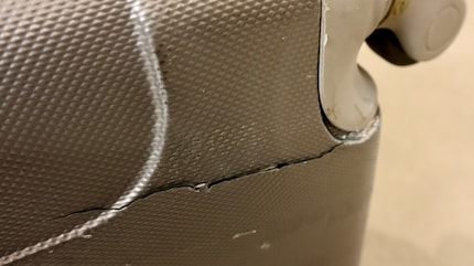 Cracked and no longer fit to fly: I’ll part with the suitcase. Maybe it’ll come in handy elsewhere.