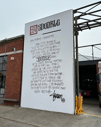 This sign reveals: Shawn Stussy collaborates with Globe.