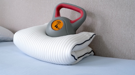 This foam pillow does what feather down pillows usually do. You can crumple it up to suit your needs.