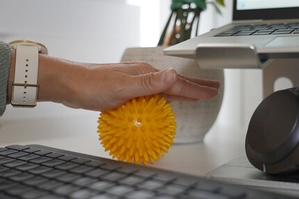 Taking matters into your own hands: a massage ball does your palms a world of good.