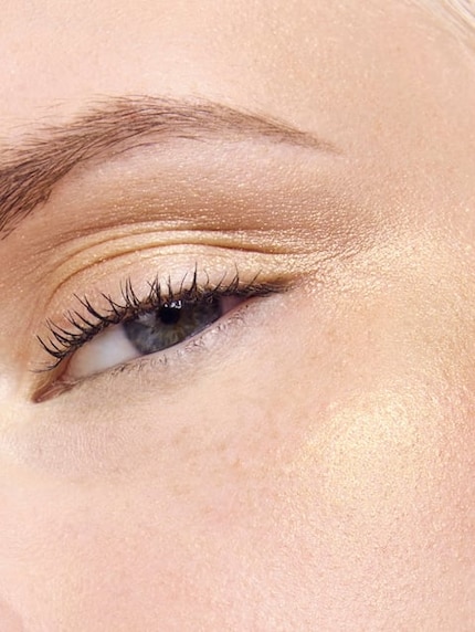 Golden accents on the face.