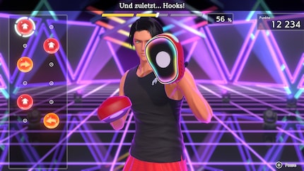 My trainer’s geared up with boxing pads.