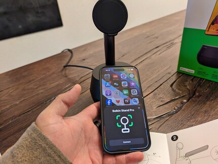 Simply hold the iPhone up to the stand and the connection starts.
