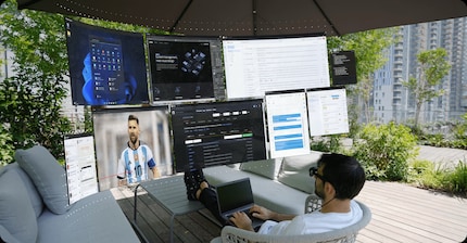 The virtual office with a huge monitor.