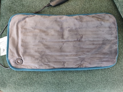 La face supérieure du coussin chauffant est uniformément plate...