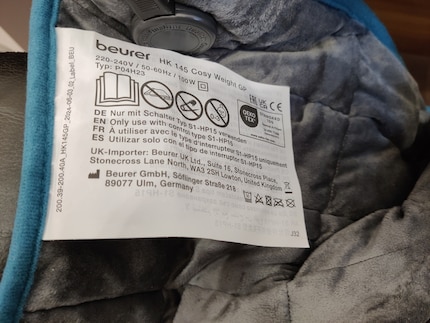 L’étiquette d’information sur le coussin chauffant est surdimensionnée et dérange. J’envisage de la couper.