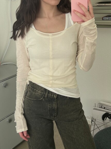 Or under a transparent long-sleeved shirt for a layering effect.