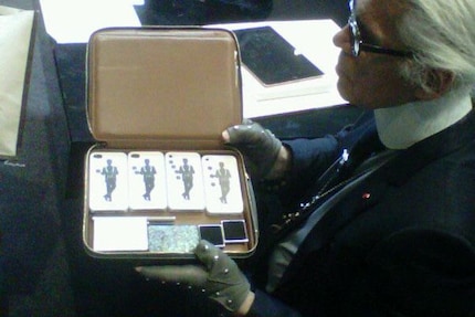 Karl Lagerfeld always had a kind of media case with him when travelling.