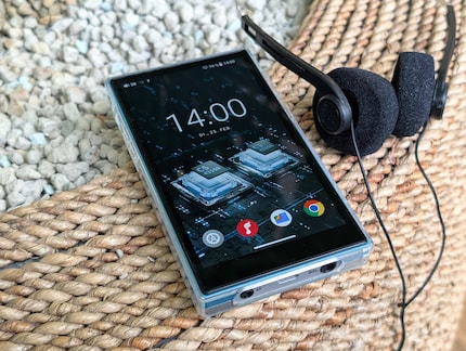 There are two ports for headphones or a hi-fi system on the bottom of the device.