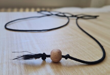 My modified version for Jasper: a wooden bead instead of a mouse on the rubber cord.