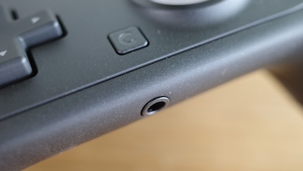 The C button (top) and the headphone jack (bottom).