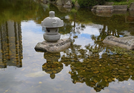 The lanterns, like the Japanese garden itself, originally come from China.