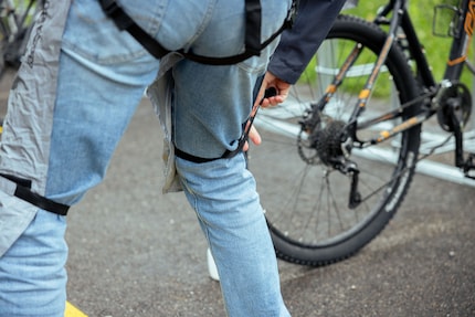I use elastic bands to fasten the trousers to me.