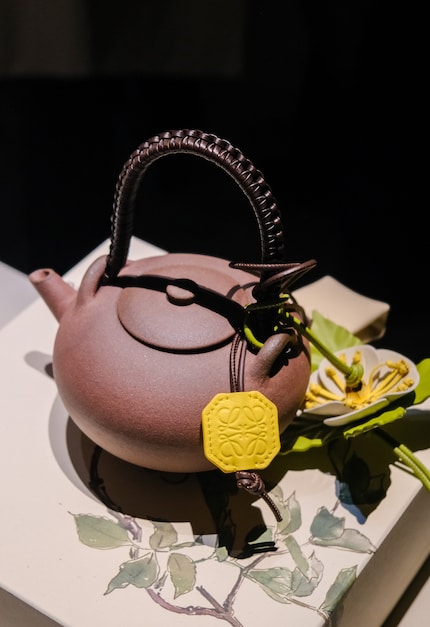 Loewe: Teapots, 2025, leather and raw clay.