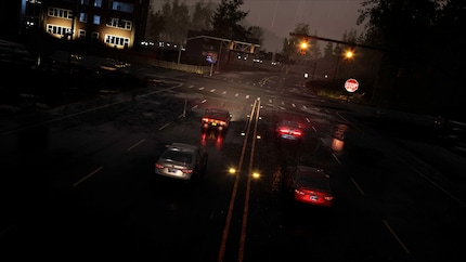 Die Straße glänzt im Regenlicht, doch gleich wird sie zur Bühne für umfassende Zerstörung.