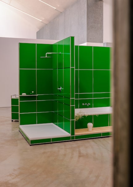 A free-standing bath and shower ...