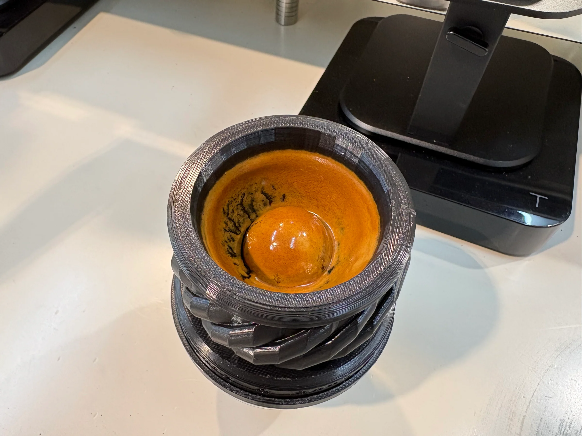 The bitter crema remains in the tool.