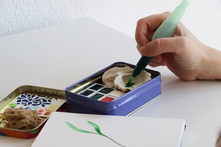 Die perfekte Ergänzung für unterwegs: ein Wassertank-Pinsel.