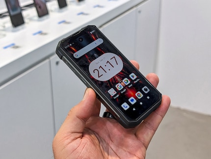 The miniature rugged phone fits comfortably in the hand.