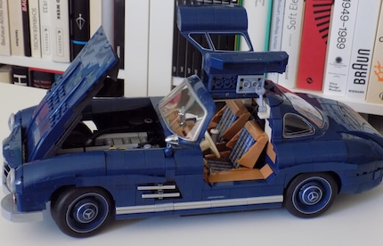 Der Lohn für die ganze Arbeit. Die geschrumpfte Automobil-Ikone kann in die Vitrine.